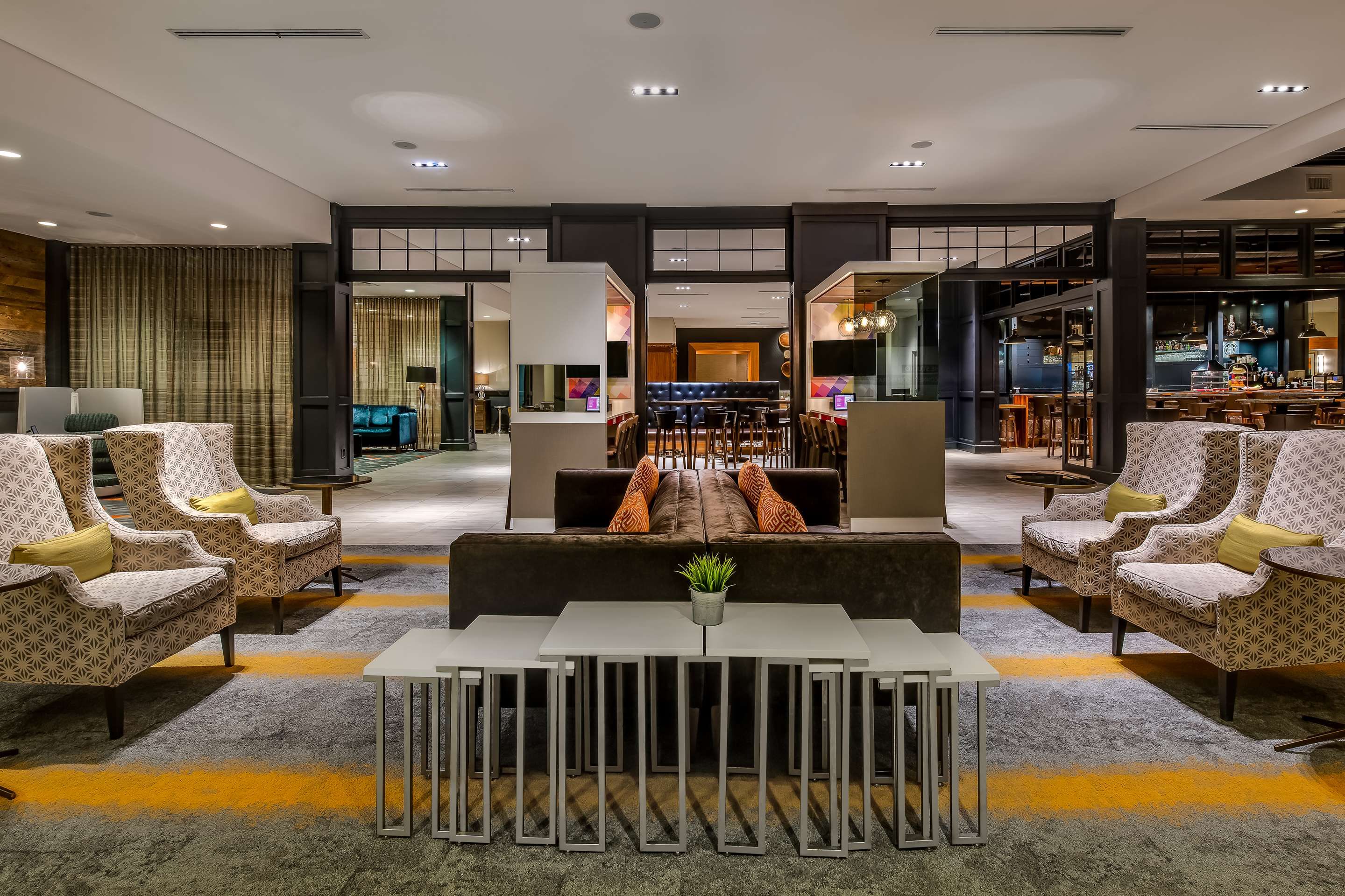 Sonesta Charlotte Lower South End lobby lounge with contemporary sofas, armchairs, and modern lighting