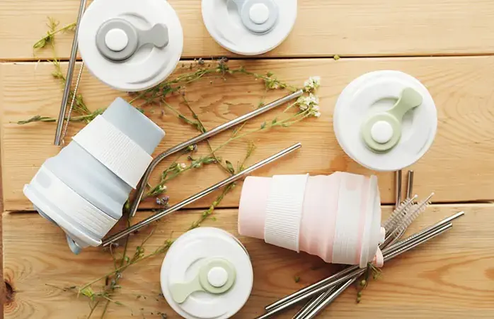 reusable silicone cups. folding cups. replacement of plastic cups; Shutterstock ID 1444171268; Purpose: Plastic free travel tips; Brand (KAYAK, Momondo, Any): momondo
